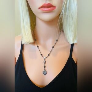 Silver metal necklace.